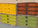 several boxes are stacked on top of each other on the ground