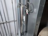 a metal box with a metal object inside of it