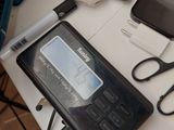 a cell phone and a pair of scissors sitting on a table