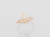 a gold ring with a pearl in the middle