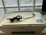 an image of a printer sitting on a window sill