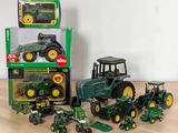 a lot of toy tractors that are on the table