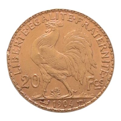 l'image d'une pièce d'or ornée d'un coq