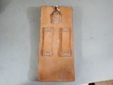 a brown leather case with a lock on it