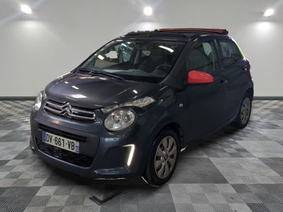 the small car is parked in the garage on the checkered floor