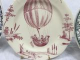 three plates with different designs of hot air balloons on them