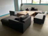 a living room with couches and a coffee table in it