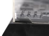 a black and white photo of a keyboard in a display case