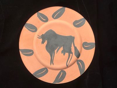 a plate with a picture of a bull on it