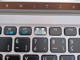 a close up of a laptop keyboard with a mouse on it