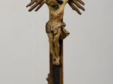 a statue of jesus on a cross on a table