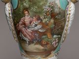 a vase with a picture of a woman and a child on it