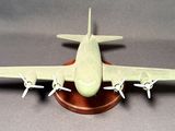 a small model of a plane on a wooden stand