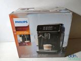 packaging of a coffee machine sitting on top of a white counter