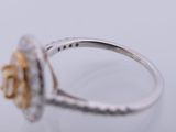 an image of a diamond and gold ring on a table