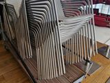 a lot of chairs that are sitting on a cart