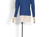 mannequin wearing a blue jacket on a white mannequin stand
