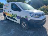 the van is parked on the side of the road in the parking lot