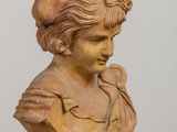 a bust of a woman wearing a hat on a table