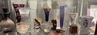 many vases on display in a glass case