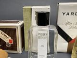 a bottle of cologne next to a box of soap and a box of soap