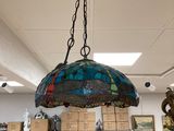 a lamp that is hanging from the ceiling in a room