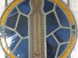 a stained glass window with a cross on it