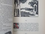 an open book with a picture of a house on it
