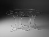 une table en verre à trois pieds avec un plateau en verre