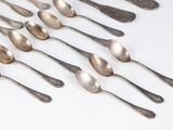 a lot of spoons and spoon spoons on the table