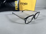 a pair of glasses sitting on top of a table next to a box
