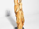 an image of a statue of a woman holding a child