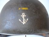 a close up of a helmet with an anchor on it
