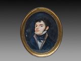 un portrait ovale représentant un homme vêtu d'une veste bleue et d'un nœud papillon