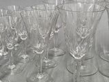 a lot of wine glasses sitting on a table