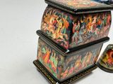 a box with a painting on it sitting on a table