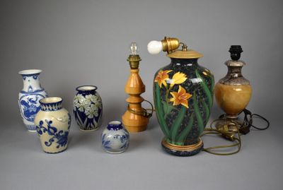 many different vases and lamps that are on the table