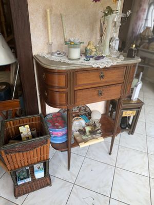 a small table with a basket on top of it