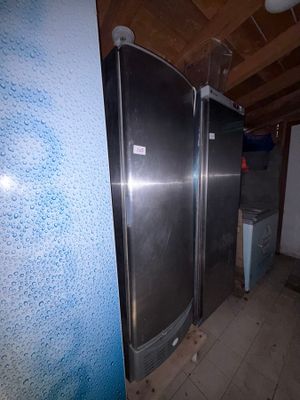 a picture of a refrigerator in a room with a blue wall