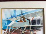 painting of a dog sitting in an airplane on display in a frame