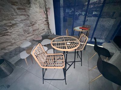 two chairs and a table in the corner of a room