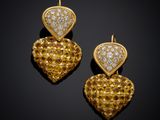 a pair of yellow sapphire and diamond earrings