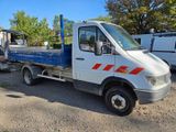 a white truck with a flat bed parked in a lot