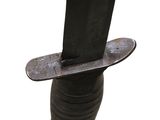 a skateboard that is attached to a metal pole