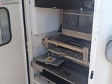 an image of a room with a refrigerator and a television