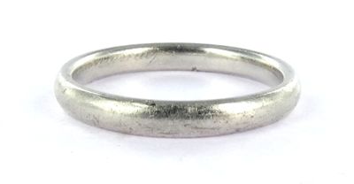 a close up of a silver ring on a white surface