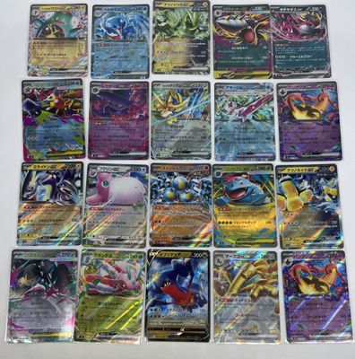 a bunch of pokemon cards sitting on top of a table