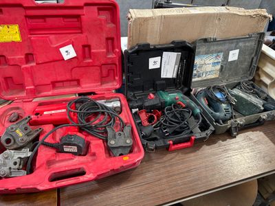 a lot of tools that are sitting on a table