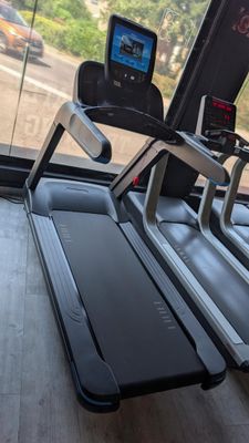 a treadmill with a monitor on top of it