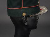 a green hat with a red stripe on top of it
